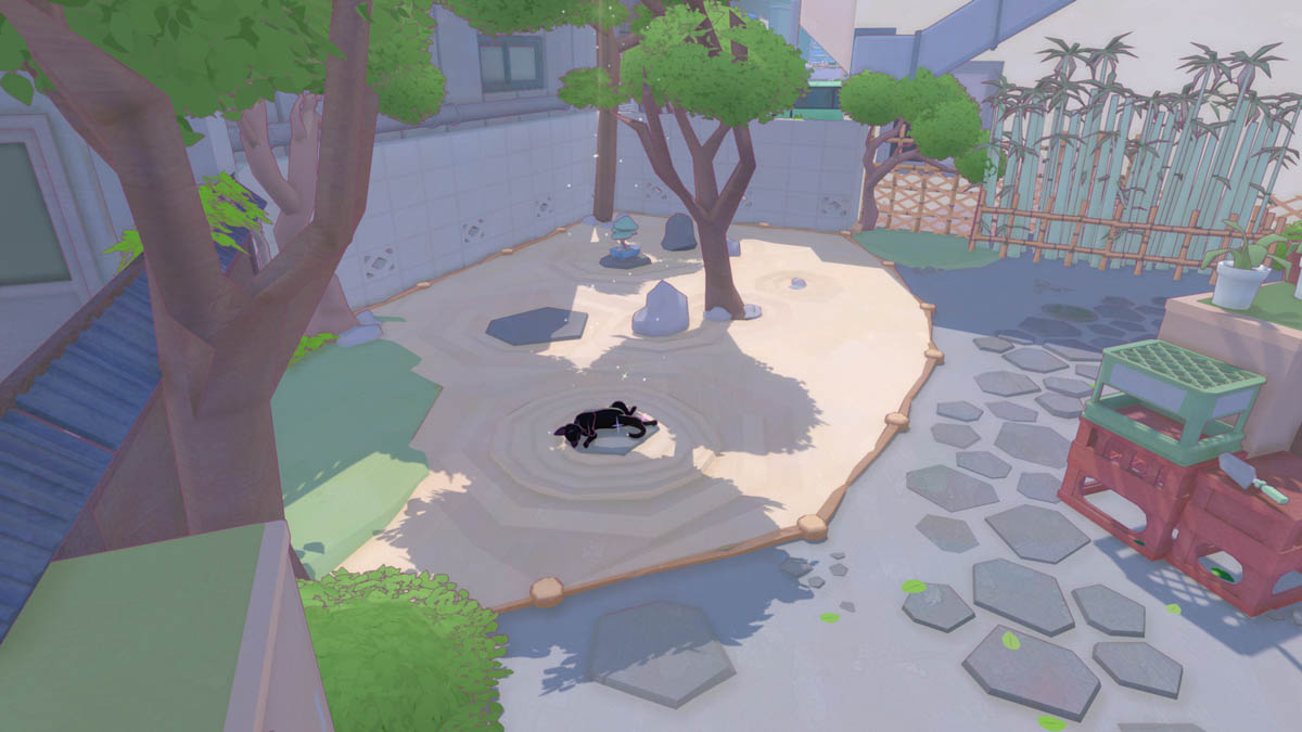 Die schwarze Katze schläft in einem Steingarten, auf den entspannt die Sonne fällt.
